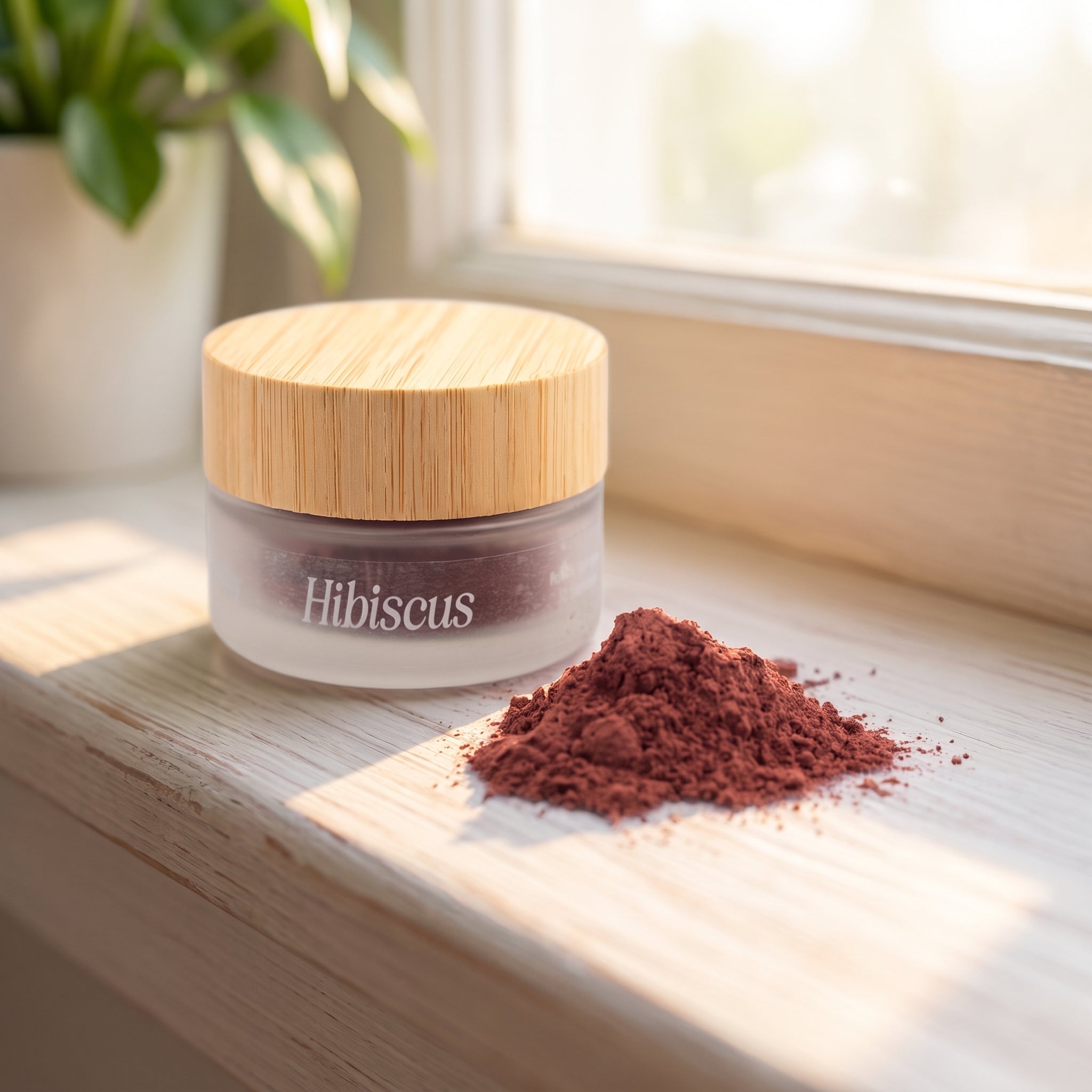 Jar of Eliézer Clay organic hibiscus powder on a painted timber windowsill in soft morning light