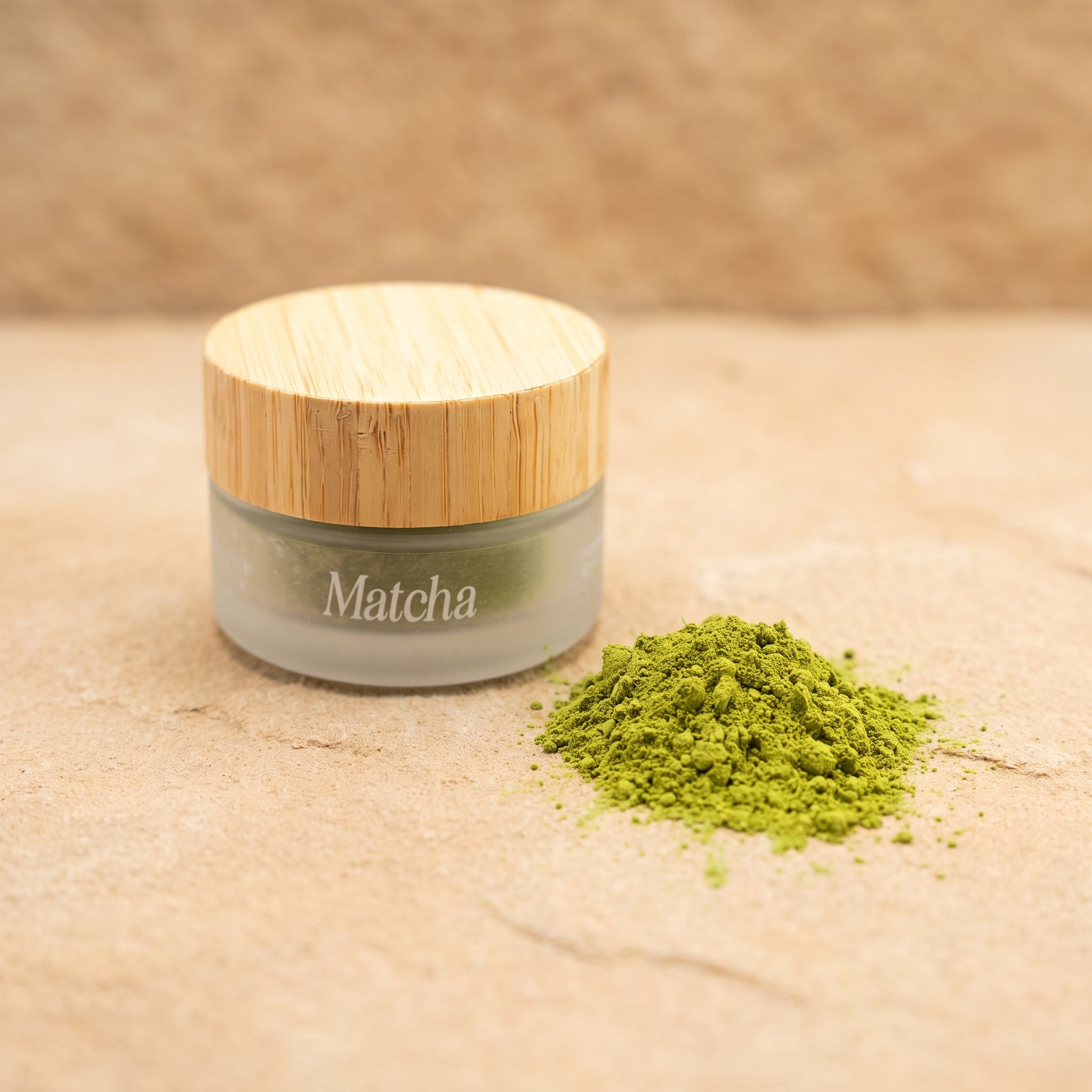Jar of Eliézer Clay matcha powder on a raw matte sandstone surface with soft shadow